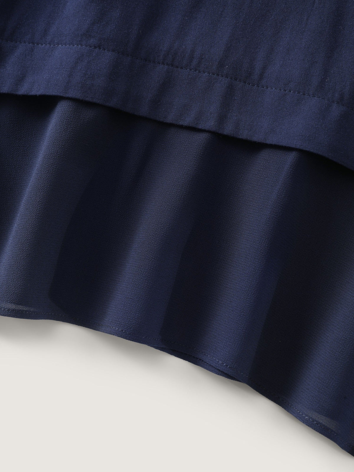 Roll‑Tab Sleeve Layered Asymmetrical Hem Blouse