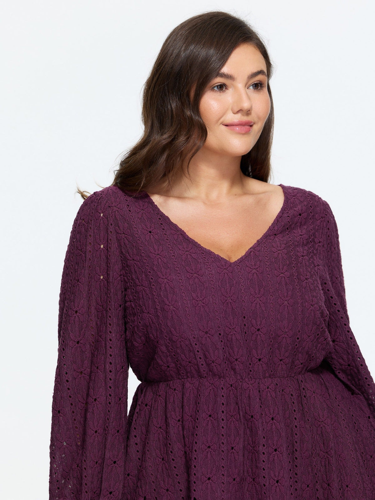 Textured Eyelet V‑Neck Peplum Blouse